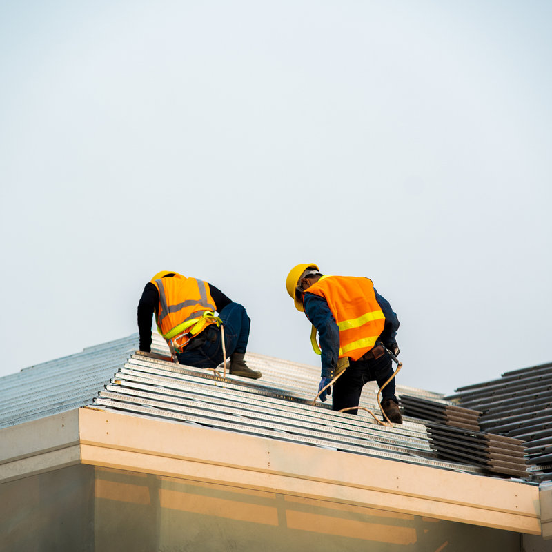 roofers performing a roof inspection